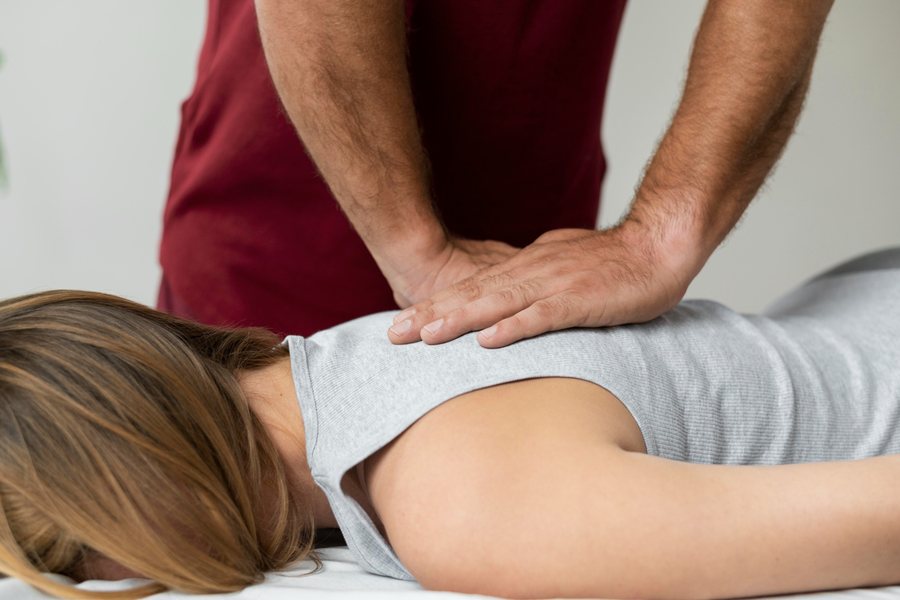 Dr. Brian Donovan performing a chiropractic adjustment at Nuro Chiropractic in Brooklyn, NY